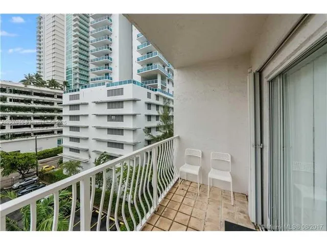 a view of balcony with furniture