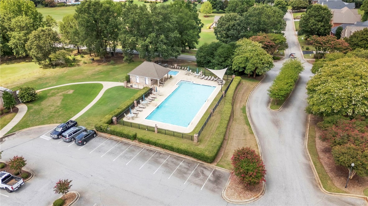 1015 Winmar Drive Anderson, SC 29621 - Photo 48 of 49 This aerial view showcases a vibrant community pool area surrounded by lush greenery and well-maintained grounds.