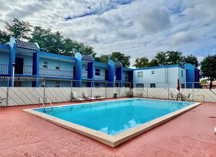 an aerial view of a house with swimming pool