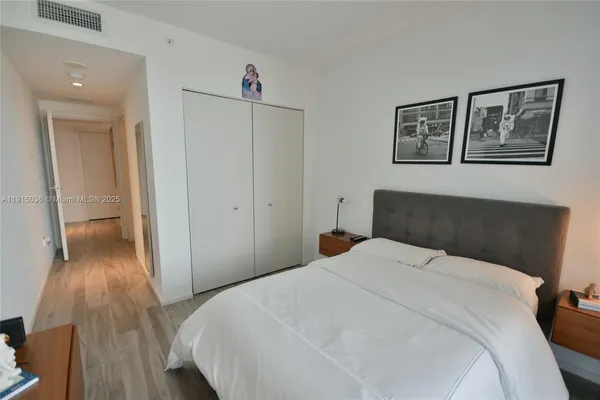 a bedroom with a bed and a view of bathroom
