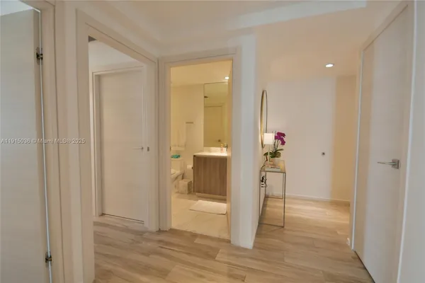 a view of entryway with wooden floor