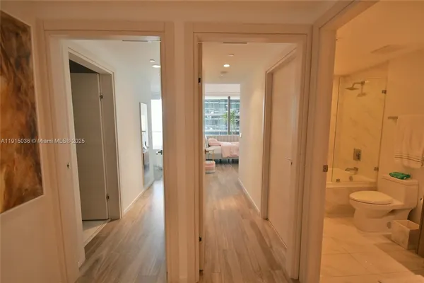 a view of a bathroom from a hallway