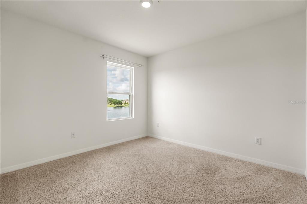 6814 Grace Hammock Road Harmony, FL 34773 - Photo 13 of 41 an empty room with a window