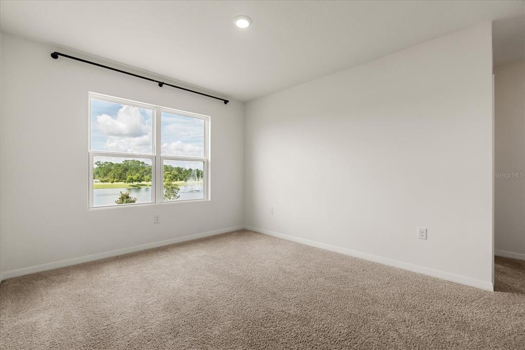 6814 Grace Hammock Road Harmony, FL 34773 - Photo 19 of 41 an empty room with windows