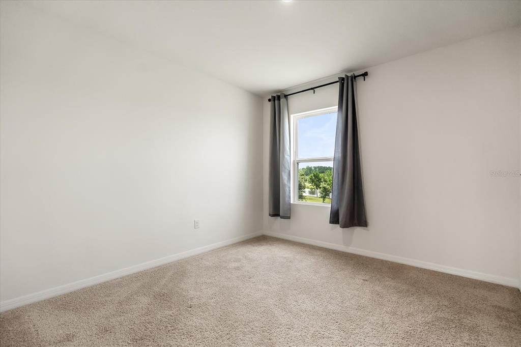 6814 Grace Hammock Road Harmony, FL 34773 - Photo 20 of 41 a view of an empty room with window