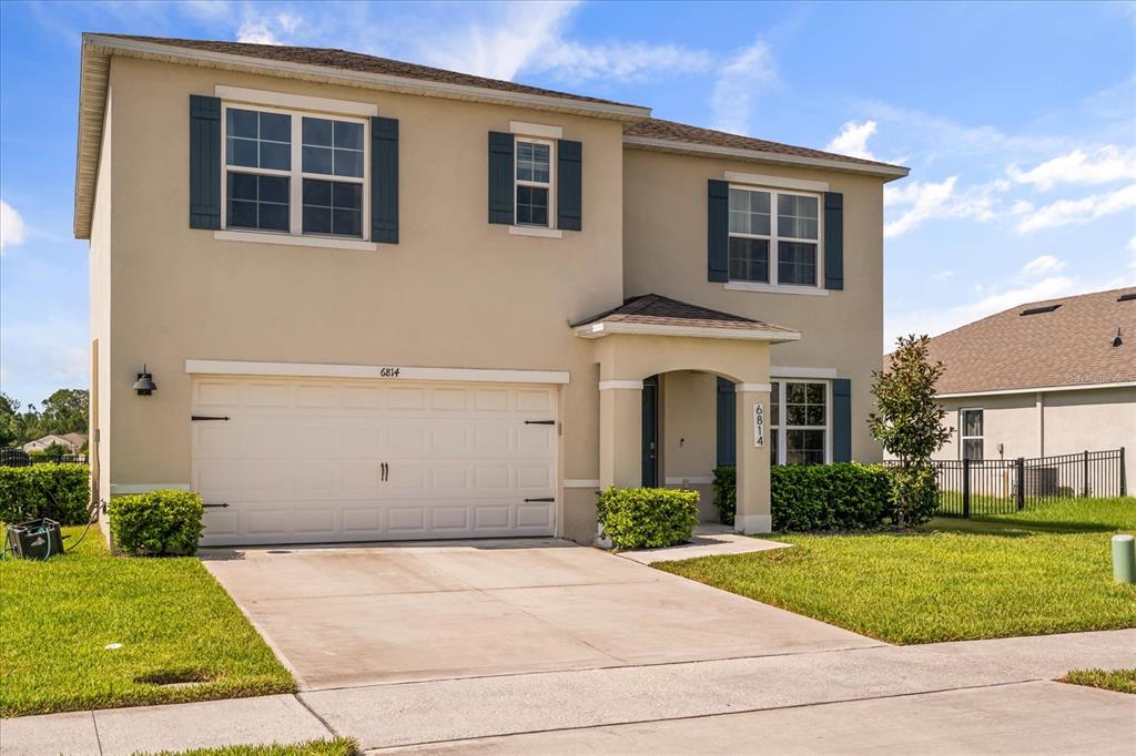 6814 Grace Hammock Road Harmony, FL 34773 - Photo 2 of 41 a view of house with yard and outdoor space