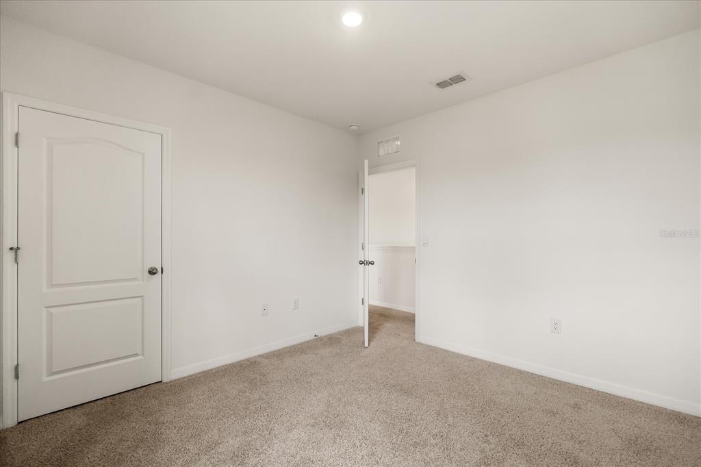 6814 Grace Hammock Road Harmony, FL 34773 - Photo 21 of 41 a view of an empty room