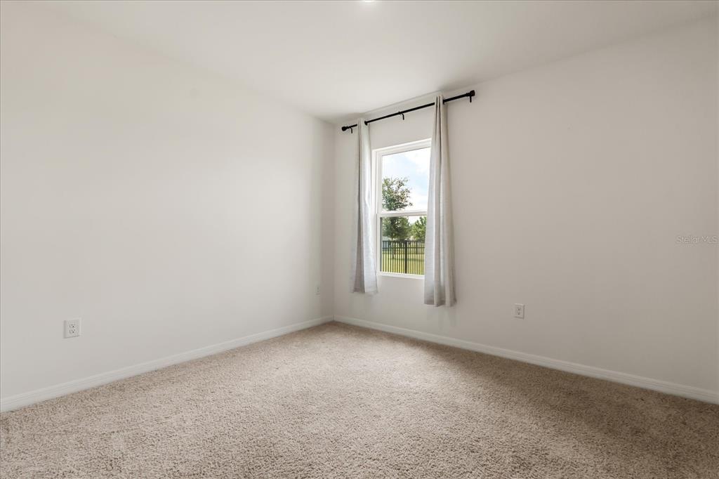 6814 Grace Hammock Road Harmony, FL 34773 - Photo 29 of 41 an empty room with a window