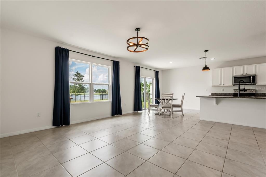 6814 Grace Hammock Road Harmony, FL 34773 - Photo 3 of 41 a view of kitchen with furniture and window