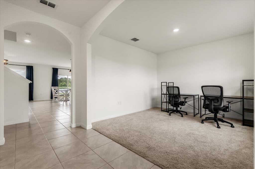 6814 Grace Hammock Road Harmony, FL 34773 - Photo 34 of 41 a view of a livingroom with workspace and a couch