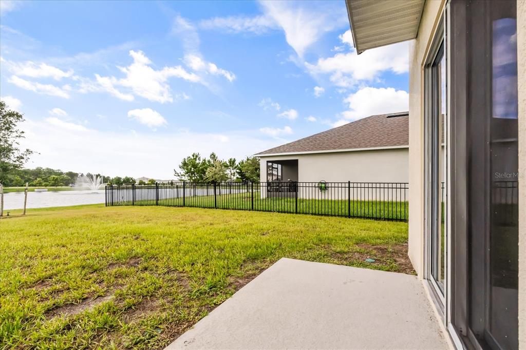 6814 Grace Hammock Road Harmony, FL 34773 - Photo 35 of 41 a view of an house with backyard space and balcony