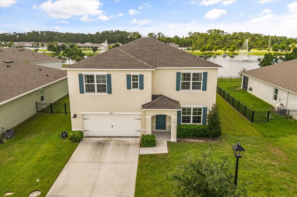 6814 Grace Hammock Road Harmony, FL 34773 - Photo 39 of 41 a front view of a house with a yard