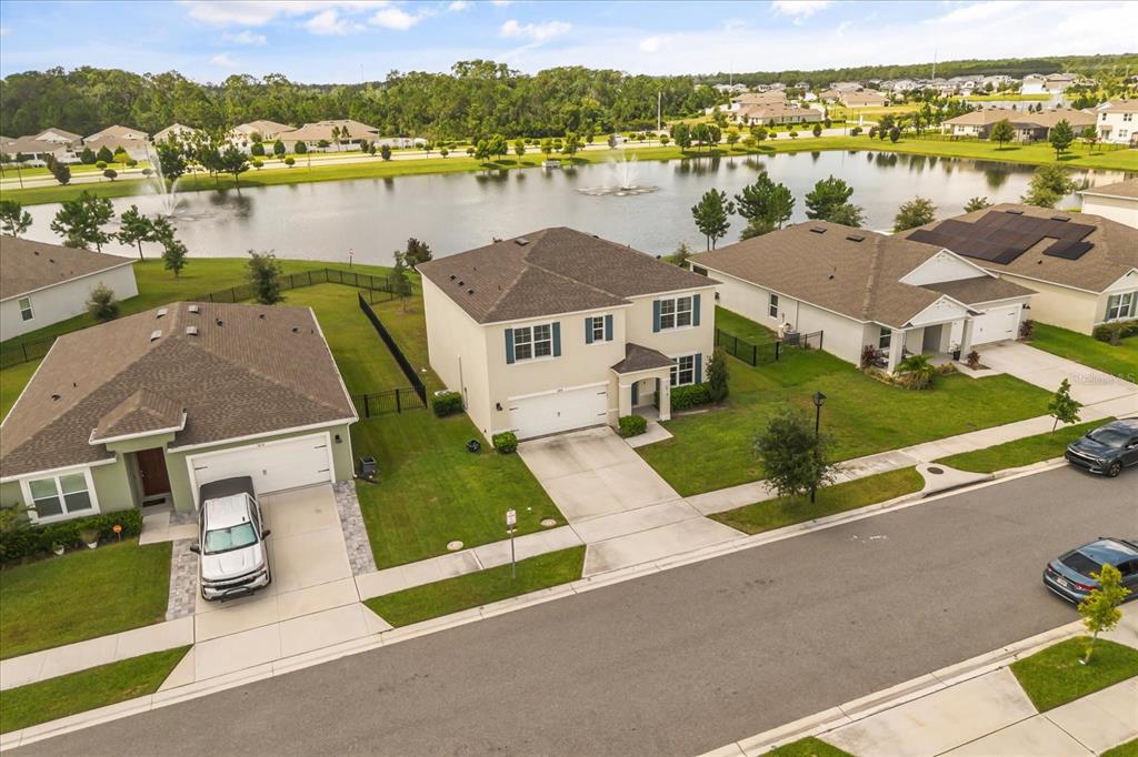 6814 Grace Hammock Road Harmony, FL 34773 - Photo 40 of 41 an aerial view of a house with outdoor space and lake view