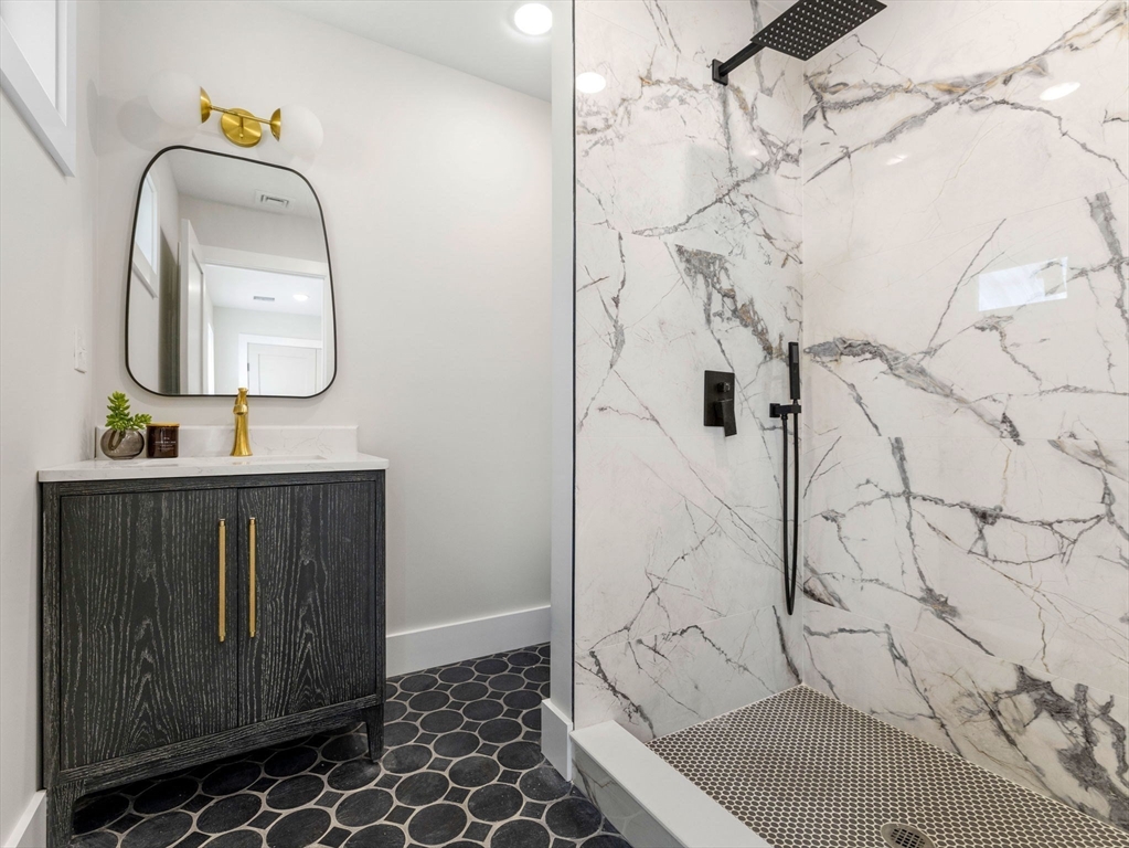 16 High Street, Unit 2 Somerville, MA 02144 - Photo 13 of 34 a bathroom with a sink and a mirror