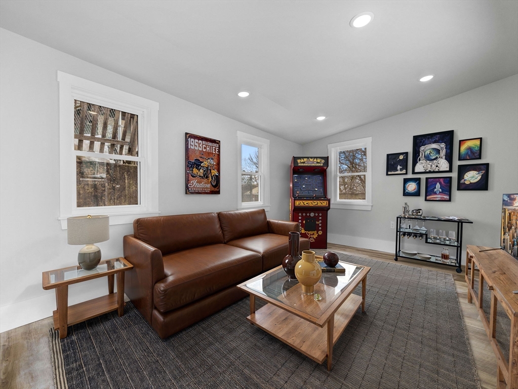 16 High Street, Unit 2 Somerville, MA 02144 - Photo 27 of 34 a living room with furniture a rug and a window