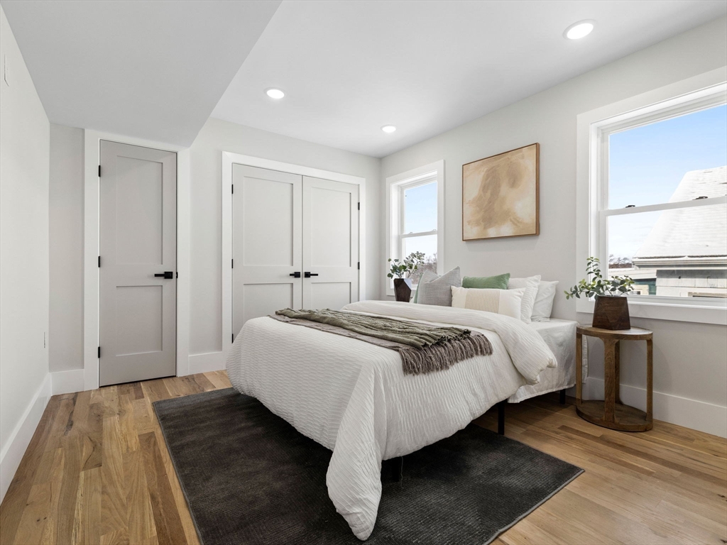 16 High Street, Unit 2 Somerville, MA 02144 - Photo 10 of 34 a bedroom with bed and a window