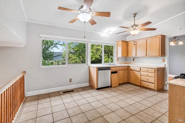 a kitchen with a stove a sink and a microwave