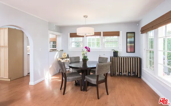 a view of a dining room with furniture window and outside view
