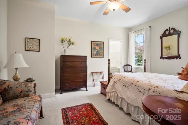 a bedroom with a bed and dresser