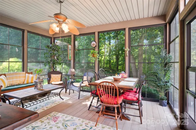 a view of a dining room with furniture wooden floor and chandelier