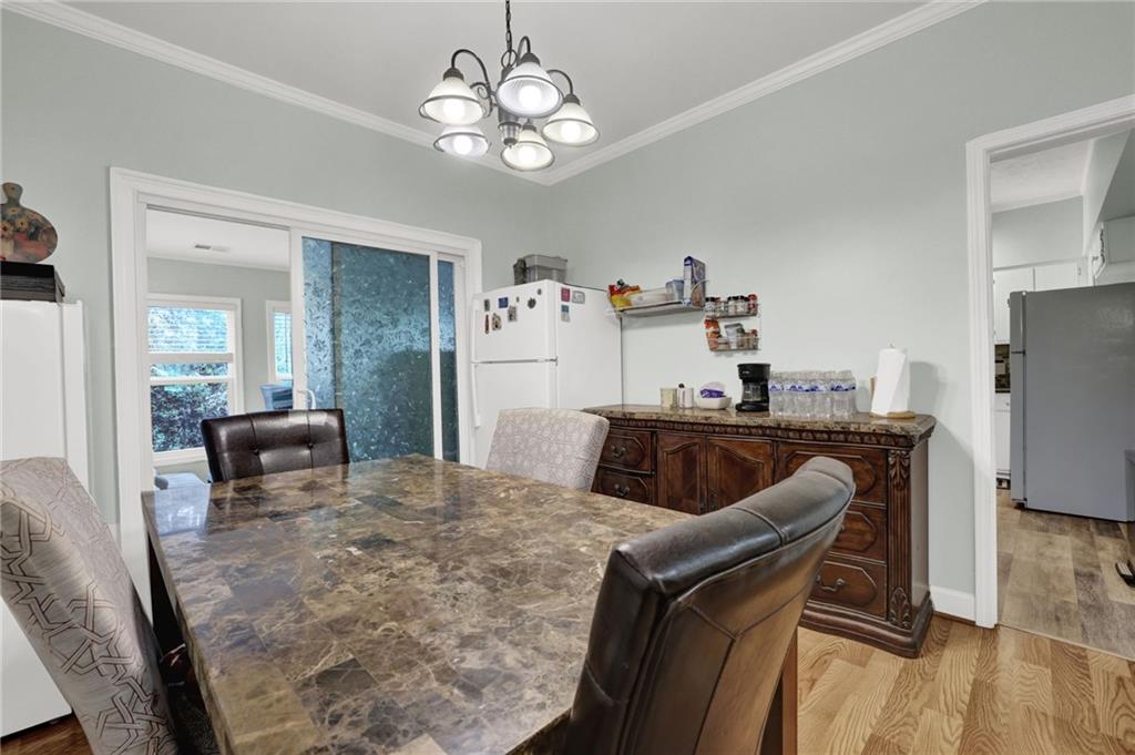 3825 Lavista Road, Unit O1 Tucker, GA 30084 - Photo 14 of 36 a view of a dining room with furniture and wooden floor