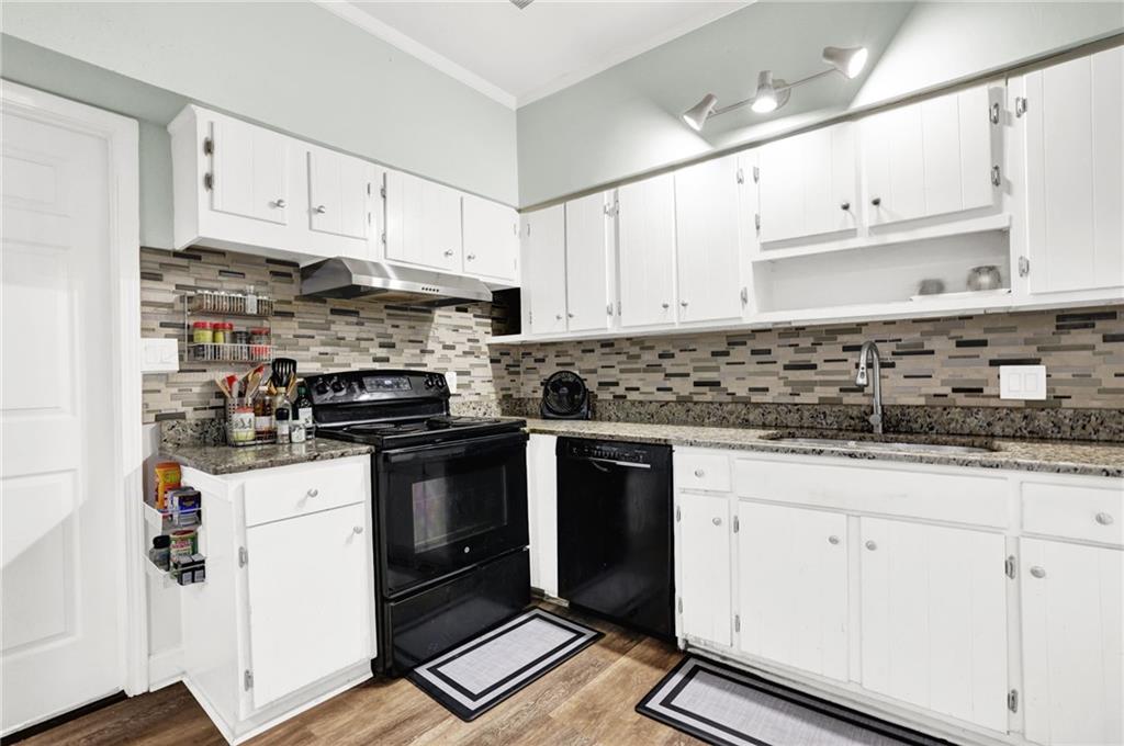 3825 Lavista Road, Unit O1 Tucker, GA 30084 - Photo 15 of 36 a kitchen with granite countertop white cabinets and stainless steel appliances