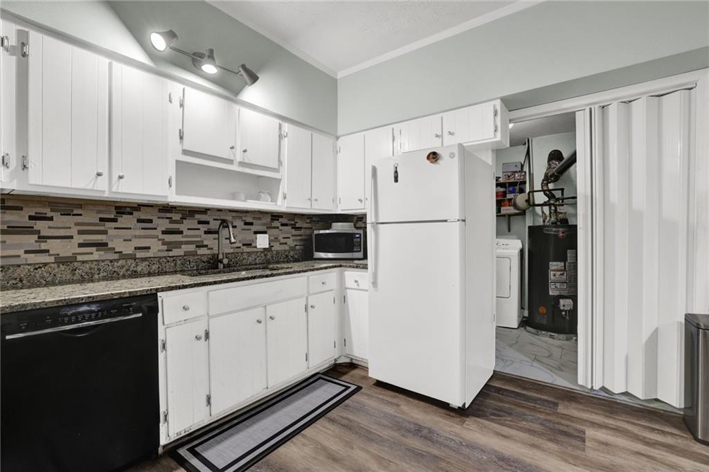 3825 Lavista Road, Unit O1 Tucker, GA 30084 - Photo 17 of 36 a white refrigerator freezer sitting inside of a kitchen