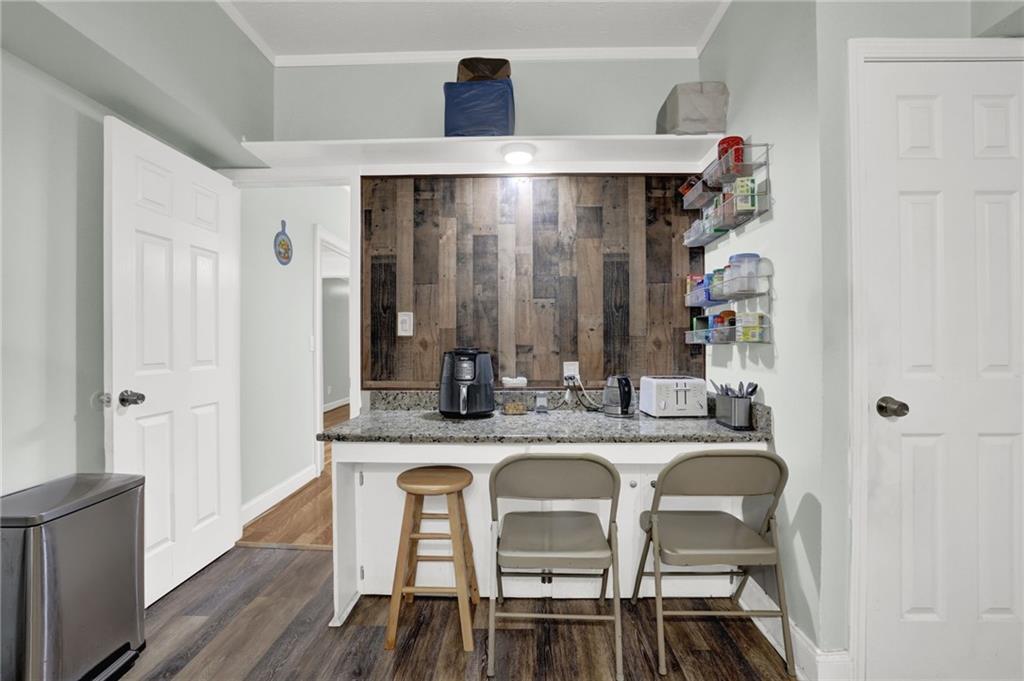 3825 Lavista Road, Unit O1 Tucker, GA 30084 - Photo 18 of 36 a dining table with chairs and wooden floor
