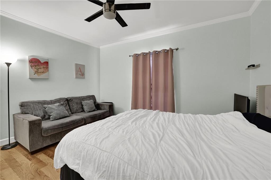 3825 Lavista Road, Unit O1 Tucker, GA 30084 - Photo 23 of 36 a bedroom with a bed and a couch