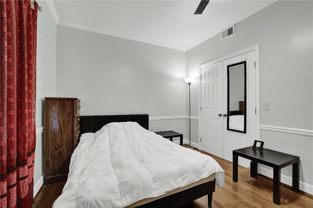 3825 Lavista Road, Unit O1 Tucker, GA 30084 - Photo 24 of 36 a bedroom with a bed and a lamp on table