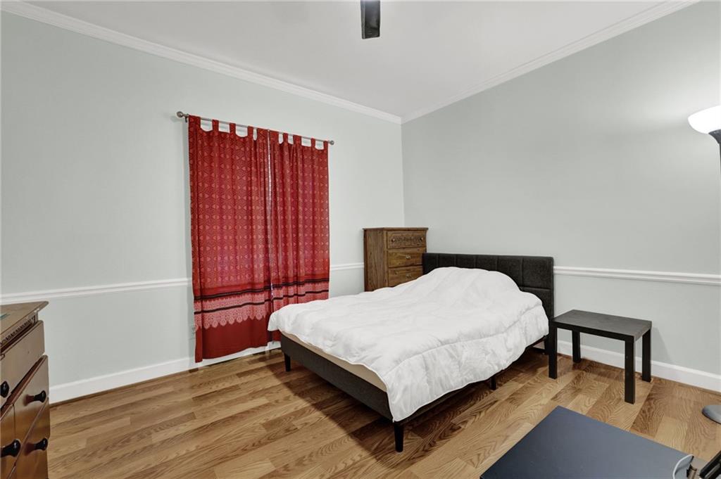 3825 Lavista Road, Unit O1 Tucker, GA 30084 - Photo 25 of 36 a bed sitting in a bedroom next to a window