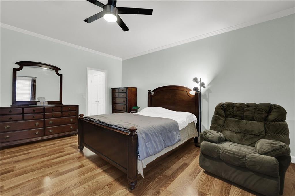 3825 Lavista Road, Unit O1 Tucker, GA 30084 - Photo 30 of 36 a bedroom with bed and wooden floor