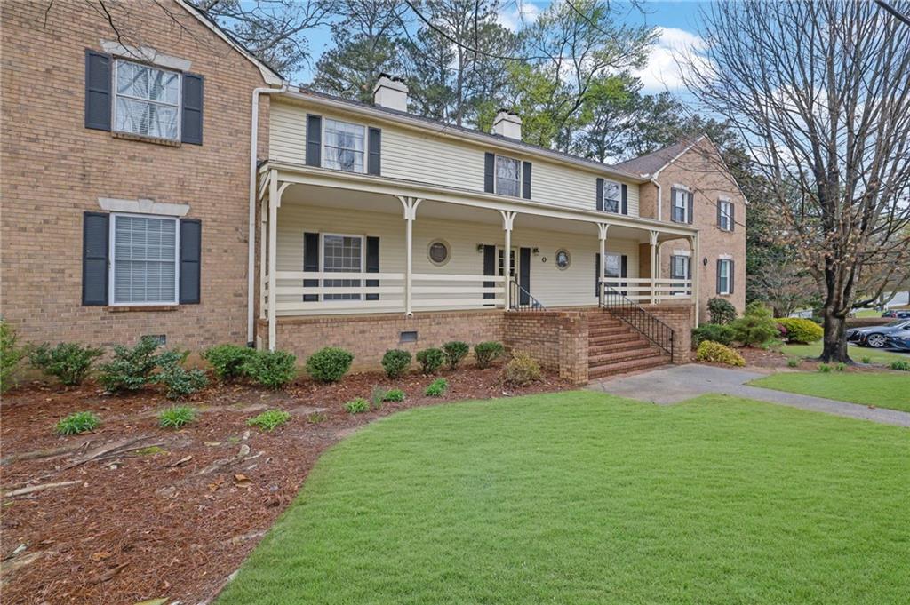 3825 Lavista Road, Unit O1 Tucker, GA 30084 - Photo 3 of 36 a front view of house with yard and green space