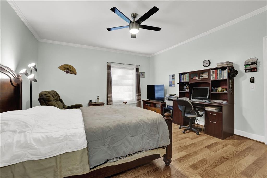 3825 Lavista Road, Unit O1 Tucker, GA 30084 - Photo 31 of 36 a bedroom with a bed and a chandelier