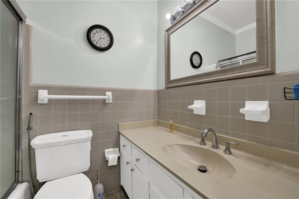 3825 Lavista Road, Unit O1 Tucker, GA 30084 - Photo 32 of 36 a bathroom with a toilet sink and mirror