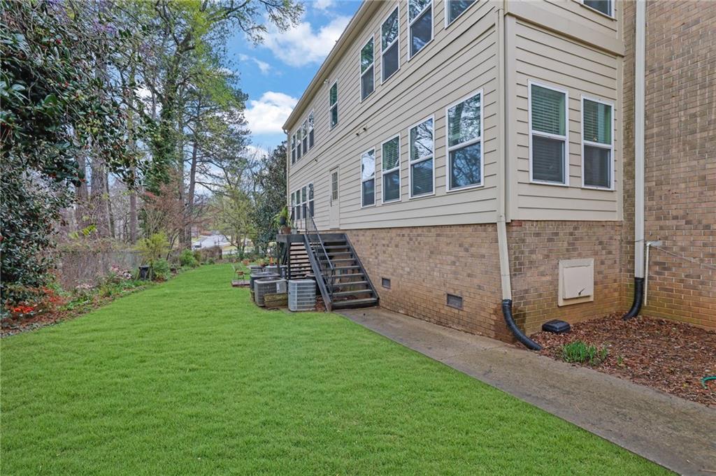 3825 Lavista Road, Unit O1 Tucker, GA 30084 - Photo 34 of 36 a view of a house with a yard