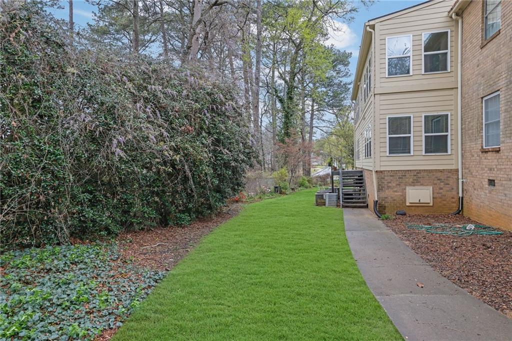 3825 Lavista Road, Unit O1 Tucker, GA 30084 - Photo 35 of 36 a view of a yard in front of a house