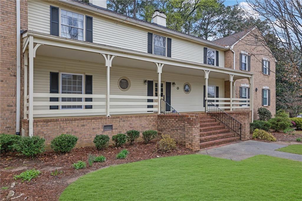 3825 Lavista Road, Unit O1 Tucker, GA 30084 - Photo 4 of 36 a front view of a house with a yard
