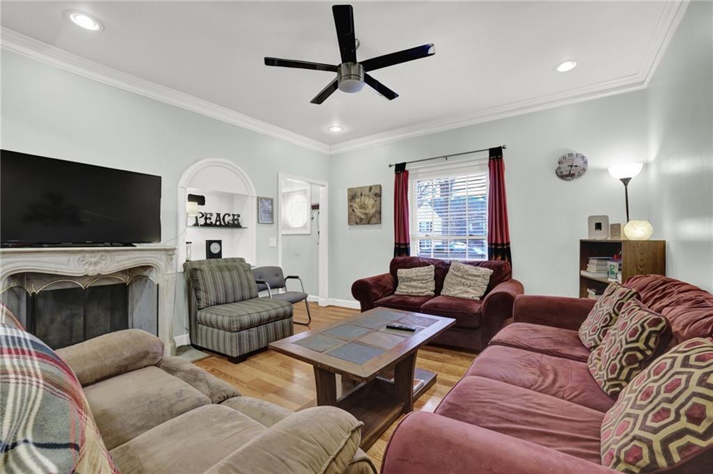 3825 Lavista Road, Unit O1 Tucker, GA 30084 - Photo 8 of 36 a living room with furniture a flat screen tv and a fireplace