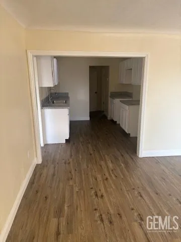 a view of kitchen and wooden floor