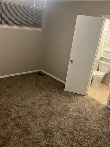 a bathroom with a sink a toilet and bathtub