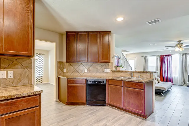 a kitchen with a stove and cabinets