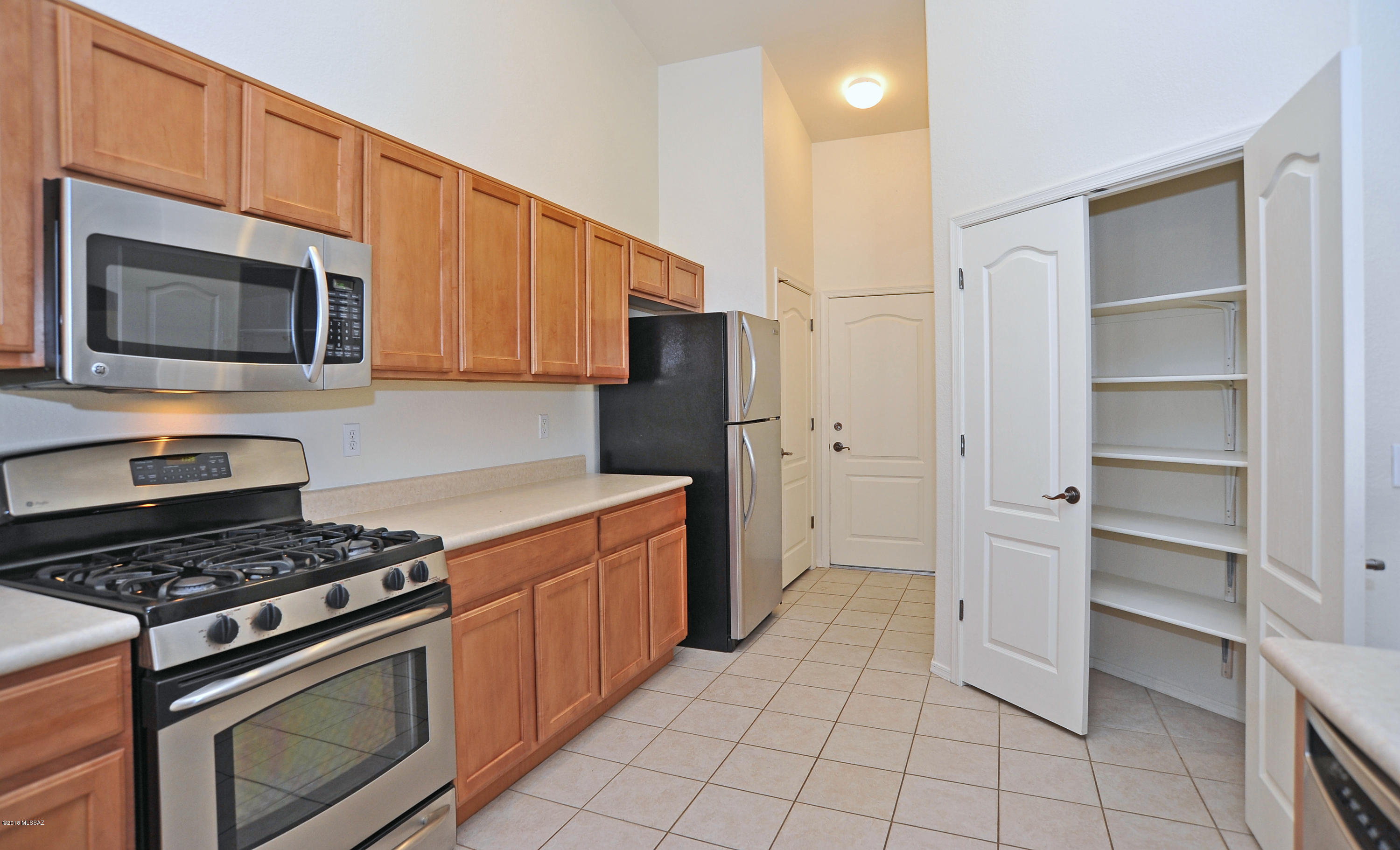 558 West Chatfield Street Vail, AZ 85641 - Photo 9 of 31 a kitchen with cabinets and steel stainless steel appliances