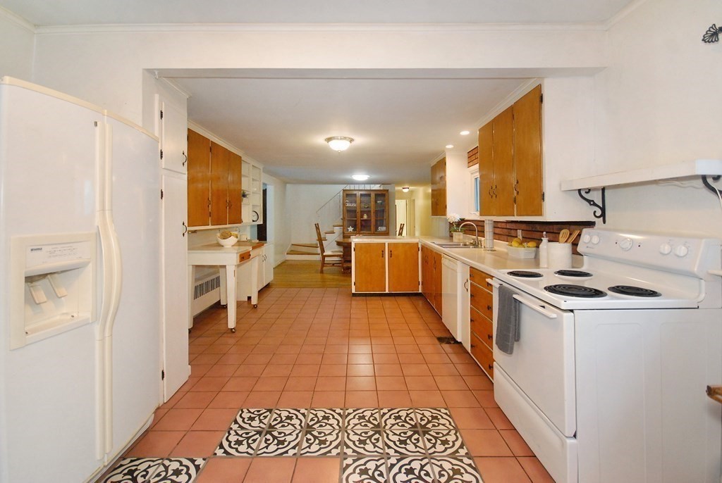 150 Lincoln Road Lincoln, MA 01773 - Photo 7 of 25 a kitchen with stainless steel appliances granite countertop a stove and a refrigerator