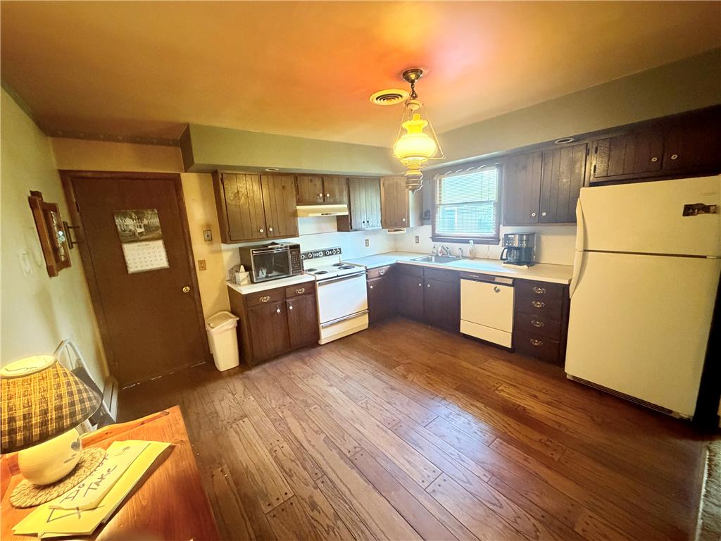 5963 Valley Road Slatington, PA 18080 - Photo 4 of 20 A well-equipped kitchen features ample cabinetry and classic wood flooring.
