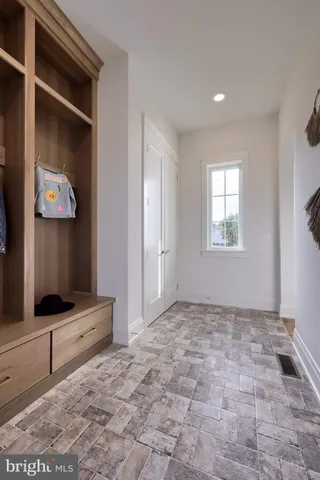 a spacious bathroom with a sink and a mirror