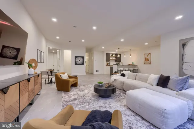 a spacious bathroom with a sink a large mirror and a shower