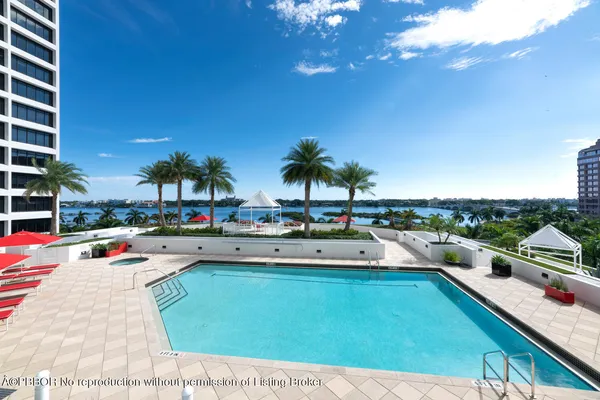 a view of swimming pool with outdoor seating