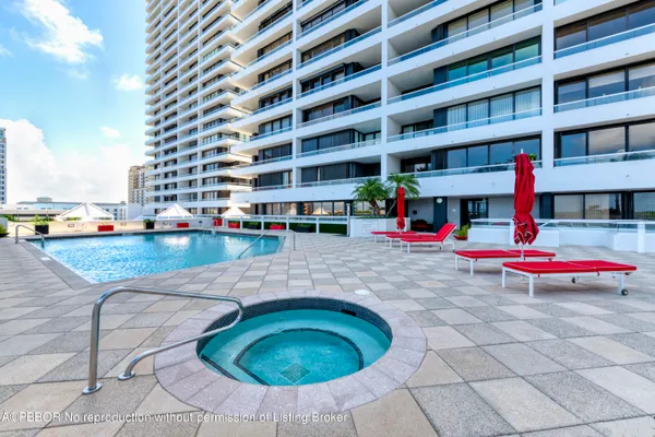 a view of a swimming pool with a yard