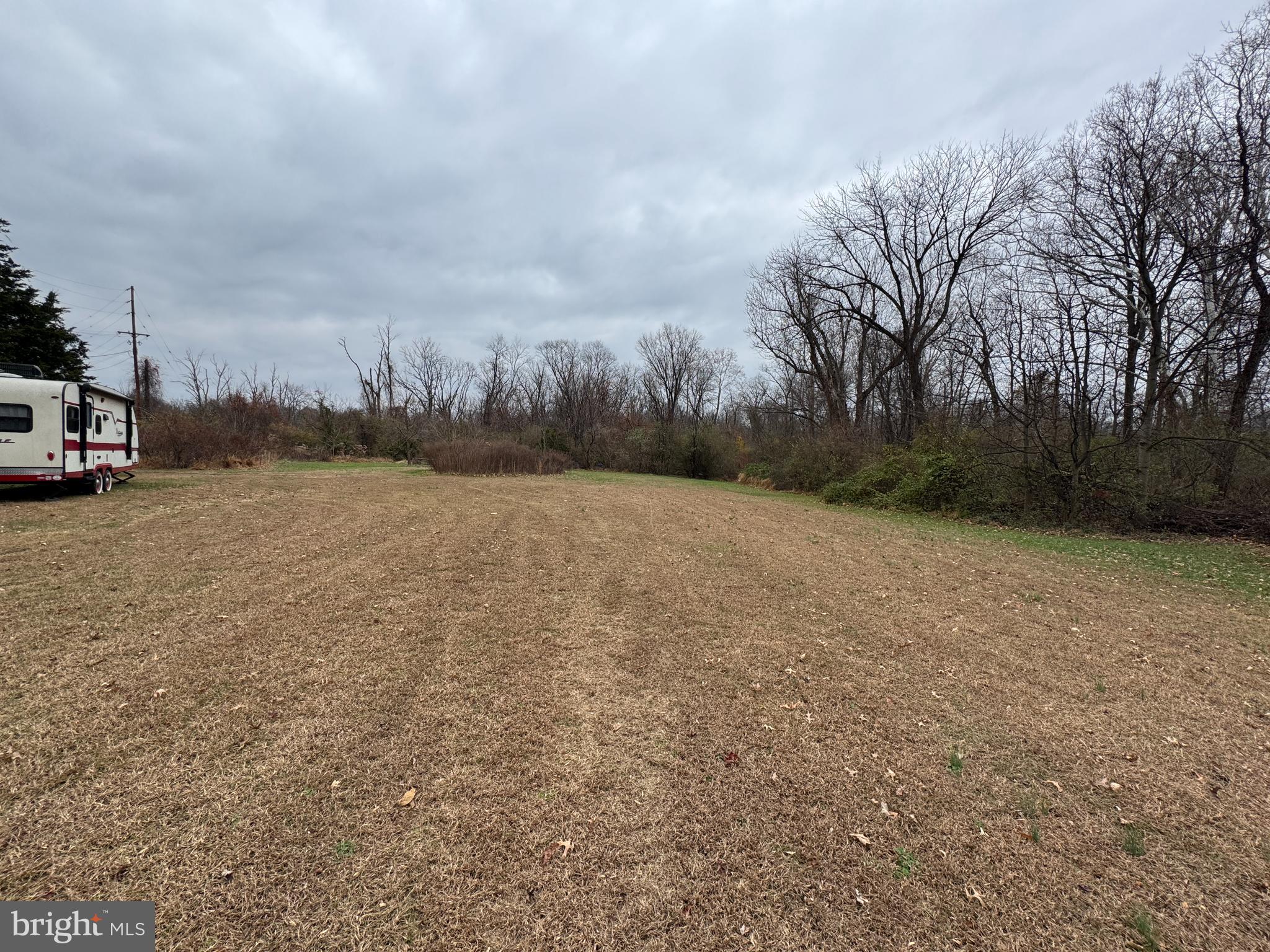 131 North Main Street Douglassville, PA 19518 - Photo 6 of 29 a view of a field with trees in the background